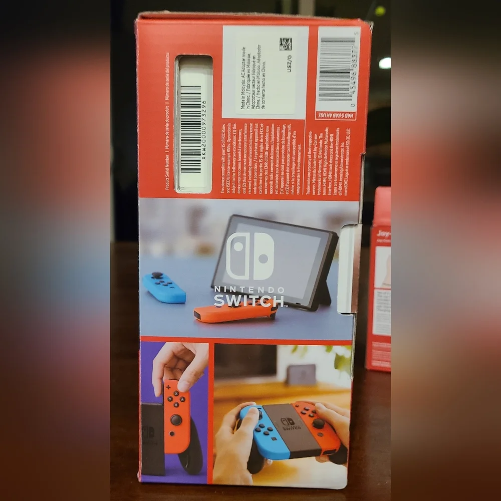 Nintendo Switch with Neon Blue & Neon Orange Joy‑Con and Purple/Yellow Set